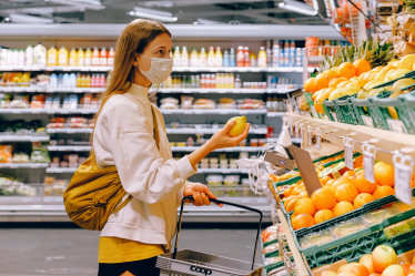 Photo by Anna Shvets: https://www.pexels.com/photo/woman-in-yellow-tshirt-and-beige-jacket-holding-a-fruit-stand-3962285/